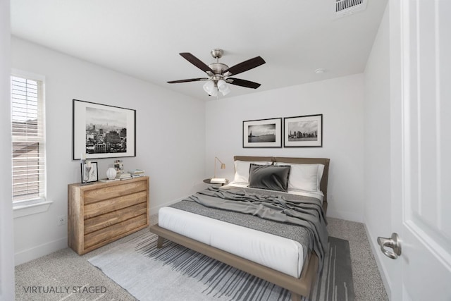 1409 Kneehigh Ln, Georgetown, TX 78633 - bedroom with multiple windows, carpet, and a ceiling fan