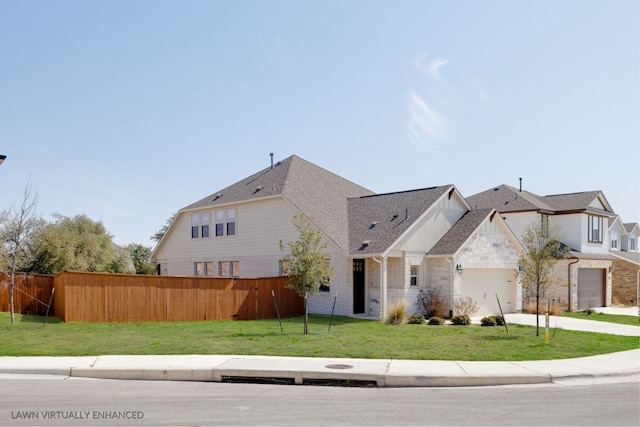 1409 Kneehigh Ln, Georgetown, TX 78633 - view of front facade with concrete driveway, stone siding, and roof with shingles