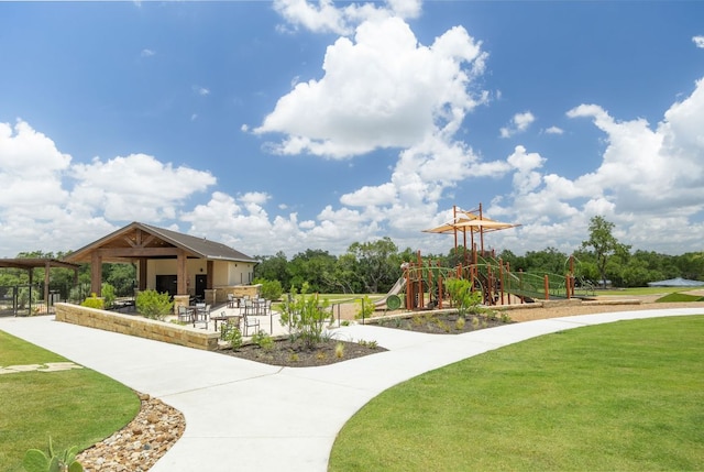 1409 Kneehigh Ln, Georgetown, TX 78633 - surrounding community featuring a lawn