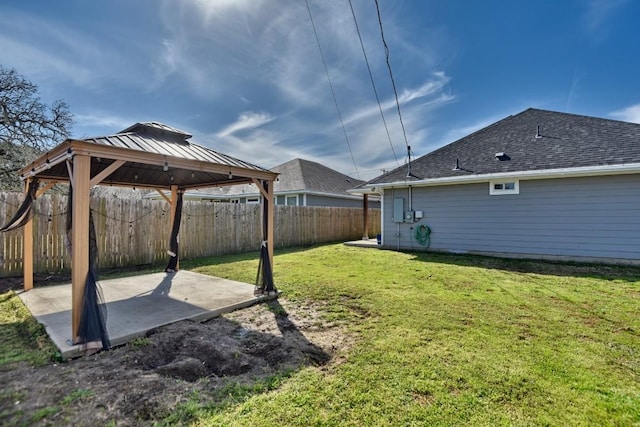 view of yard with a patio area, a fenced backyard, and a gazebo