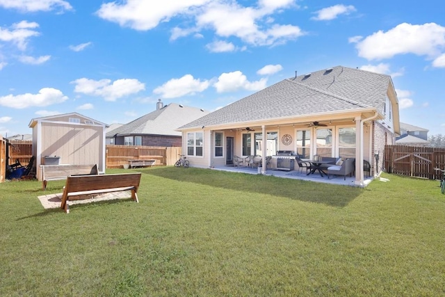 13825 Chester Knl, San Antonio, TX 78253 - rear view of house with a fenced backyard, ceiling fan, an outbuilding, a storage unit, and a patio area