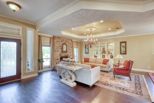 living room with ornamental molding, a raised ceiling, and dark wood-style flooring