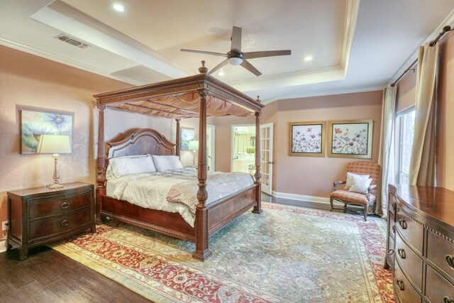 606 Free Rein, Horseshoe Bay, TX 78657 - bedroom featuring a raised ceiling, ornamental molding, wood finished floors, baseboards, and recessed lighting