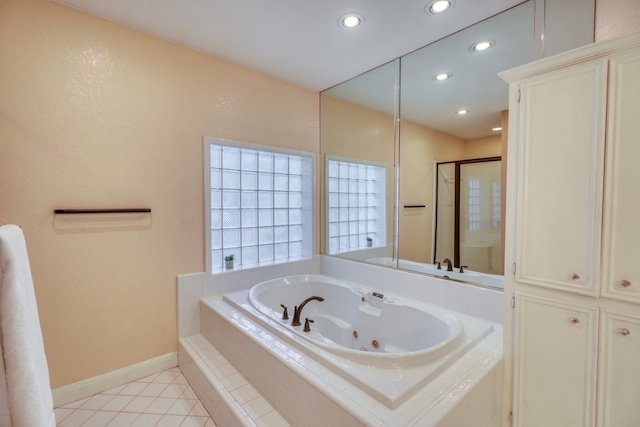 full bathroom featuring recessed lighting, baseboards, tile patterned floors, a whirlpool tub, and a stall shower