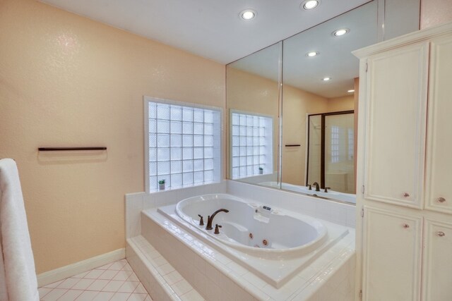 606 Free Rein, Horseshoe Bay, TX 78657 - full bath with a whirlpool tub, recessed lighting, baseboards, tile patterned flooring, and a shower stall
