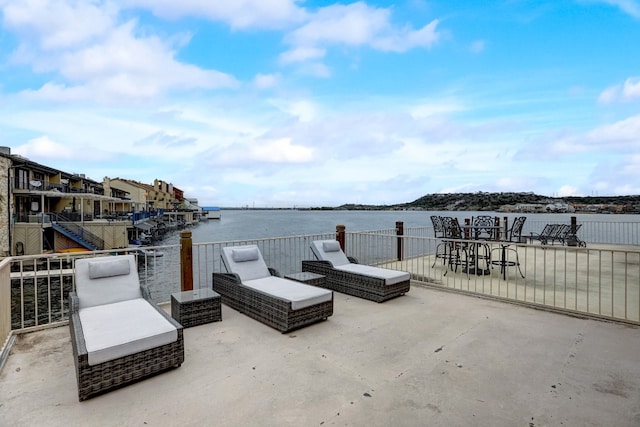 view of patio with a water view