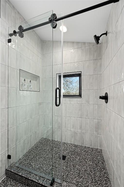 full bath featuring a shower stall