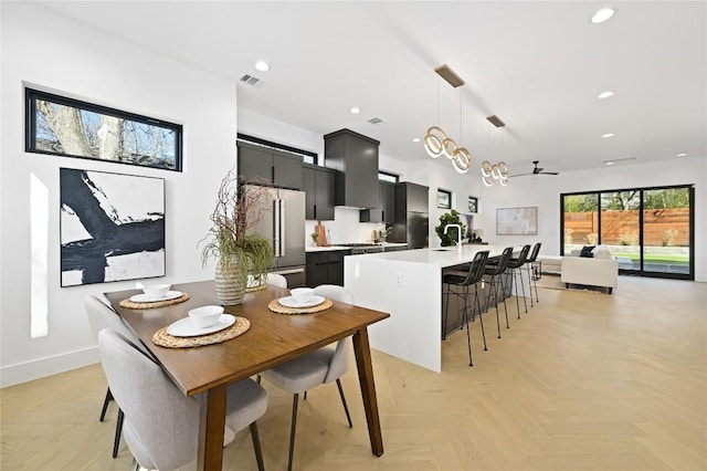 dining area featuring baseboards, visible vents, and recessed lighting