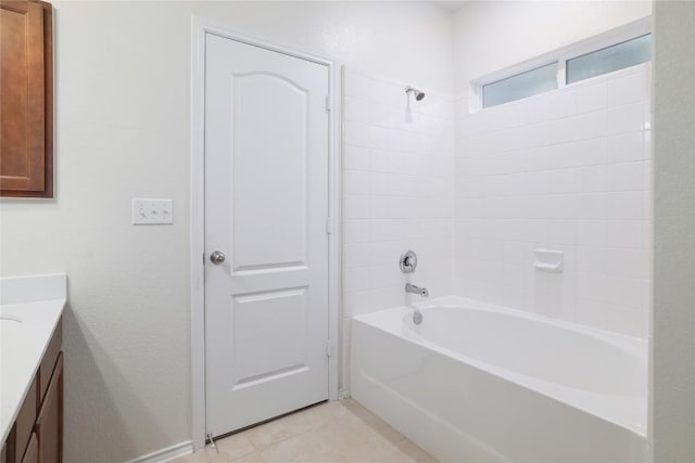 bathroom with shower / bath combination, vanity, and tile patterned floors