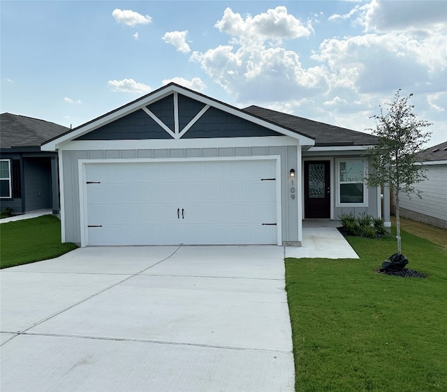 ranch-style home with an attached garage, driveway, a front lawn, and board and batten siding