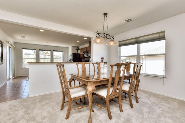 dining area with baseboards, recessed lighting, visible vents, and light colored carpet