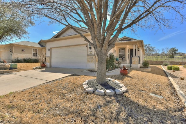 ranch-style house featuring driveway, an attached garage, and stucco siding