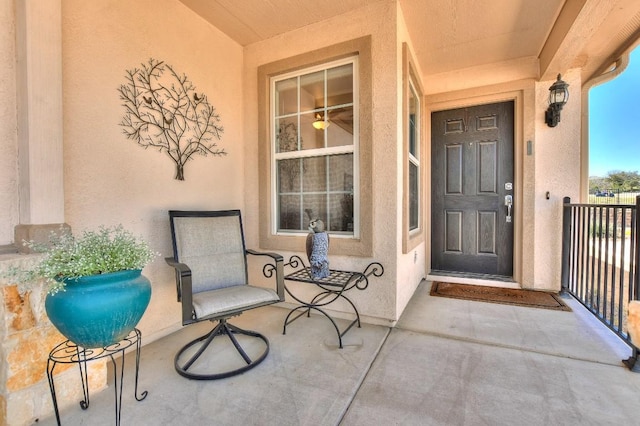 property entrance with stucco siding