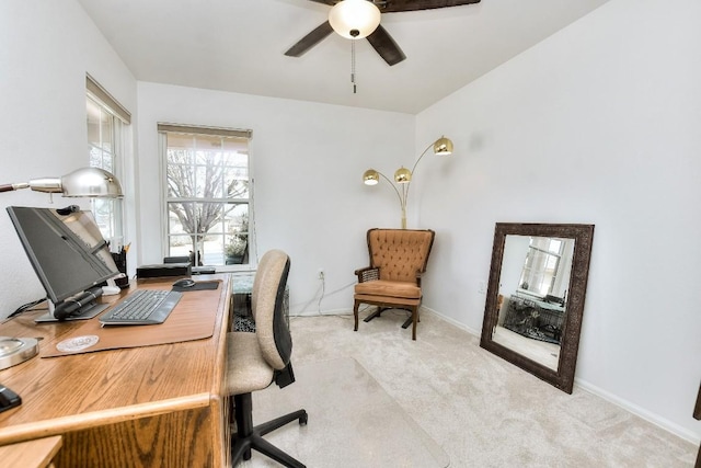 office with carpet floors and ceiling fan