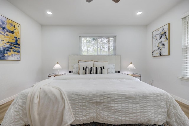 bedroom with a ceiling fan, recessed lighting, baseboards, and wood finished floors