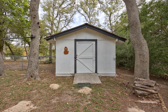 view of shed with fence