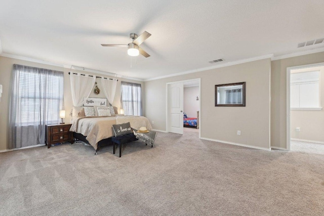 carpeted bedroom featuring visible vents, crown molding, baseboards, and ceiling fan