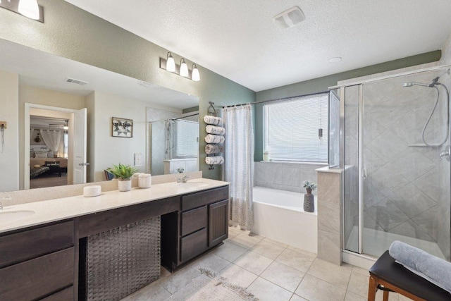 full bathroom featuring a stall shower, visible vents, and a sink