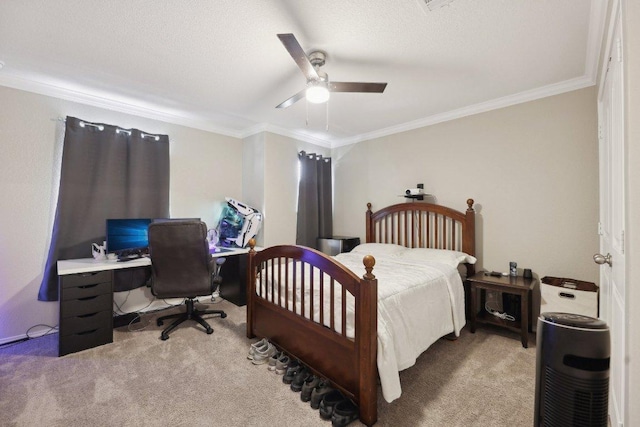 carpeted bedroom featuring ornamental molding, a textured ceiling, and a ceiling fan