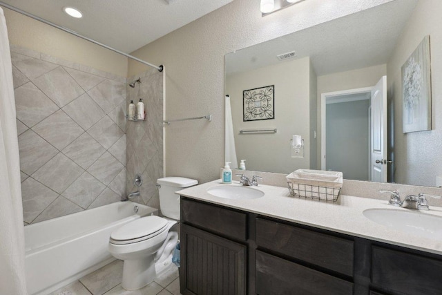 full bath featuring toilet, visible vents, a sink, and tile patterned floors