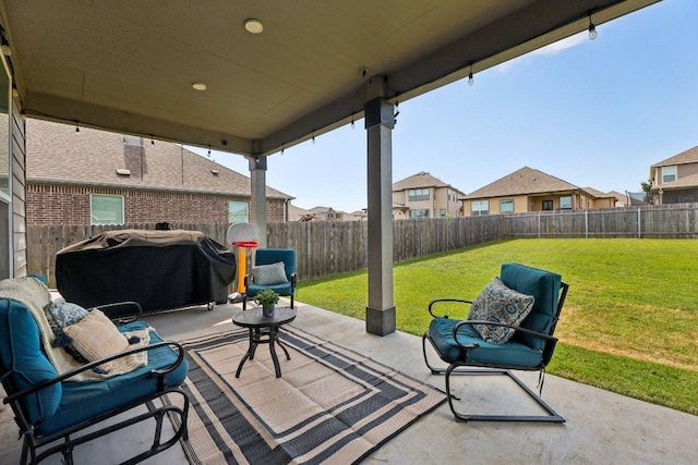 view of patio with a residential view, a fenced backyard, and area for grilling