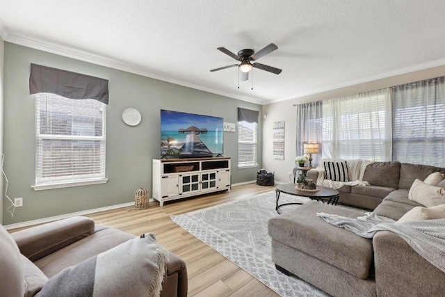 living room with a textured ceiling, ornamental molding, wood finished floors, and a ceiling fan