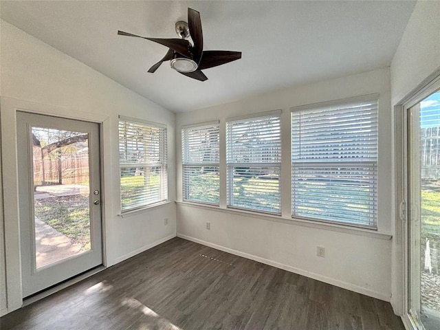 unfurnished sunroom with vaulted ceiling and a ceiling fan