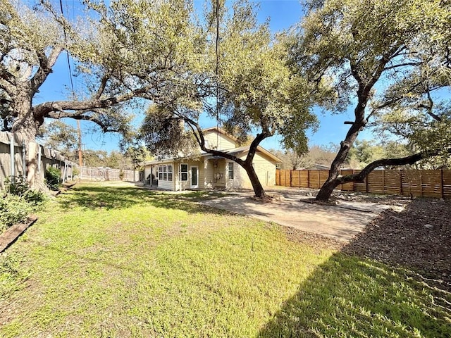 view of yard featuring a fenced backyard