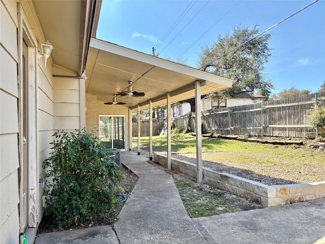 view of patio / terrace featuring ceiling fan and fence