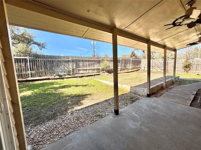 view of yard with a fenced backyard, a patio, and ceiling fan