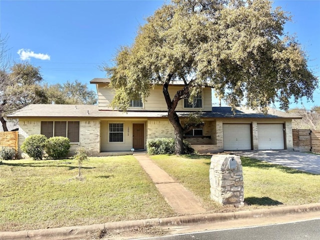 traditional home with a garage, brick siding, and a front yard