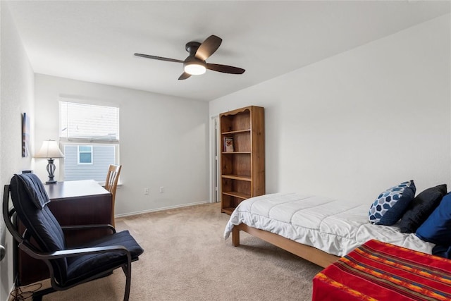 bedroom with carpet, baseboards, and ceiling fan