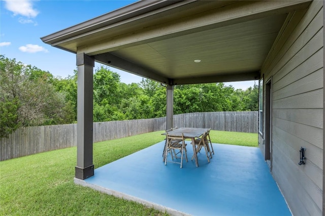 view of patio featuring outdoor dining space and a fenced backyard