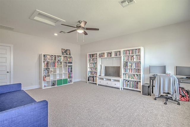 living area featuring attic access, carpet, visible vents, and baseboards