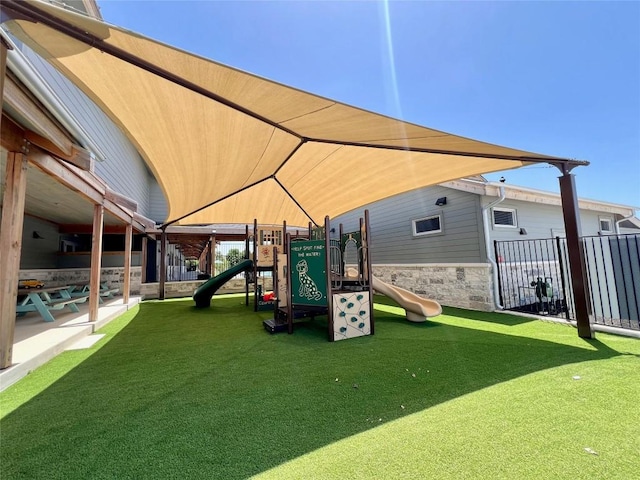 view of jungle gym featuring a yard