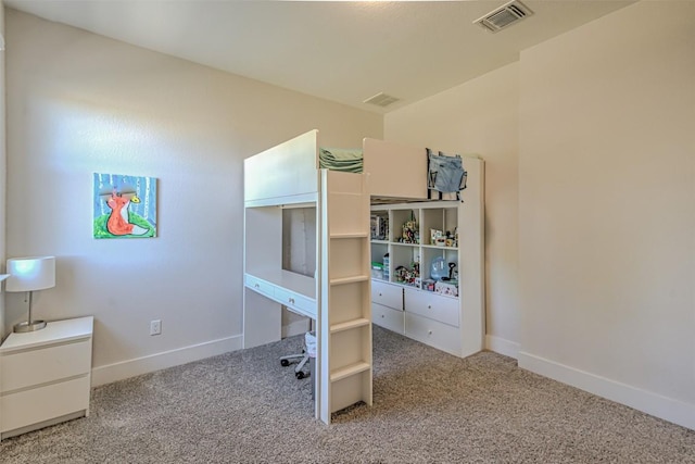 carpeted bedroom with baseboards and visible vents