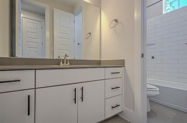 bathroom with toilet,  shower combination, and vanity