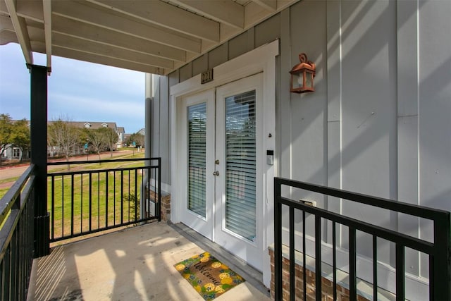 balcony with covered porch and french doors