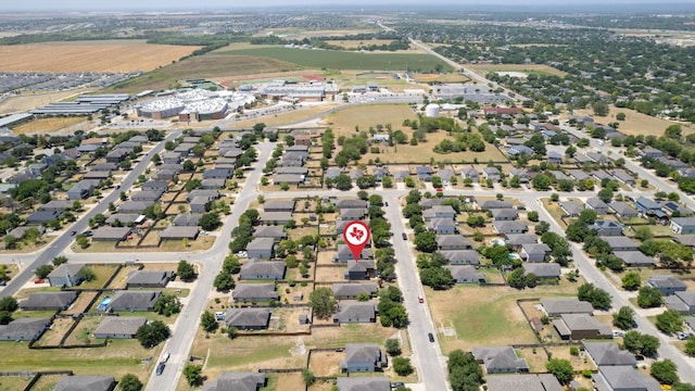 birds eye view of property with a residential view