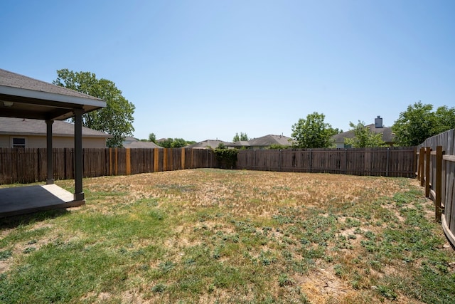 view of yard with a fenced backyard