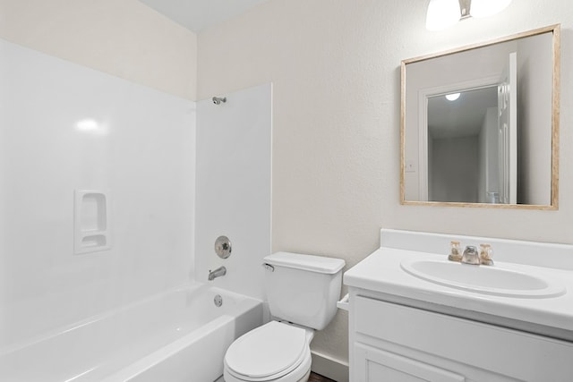 bathroom with toilet, tub / shower combination, and vanity