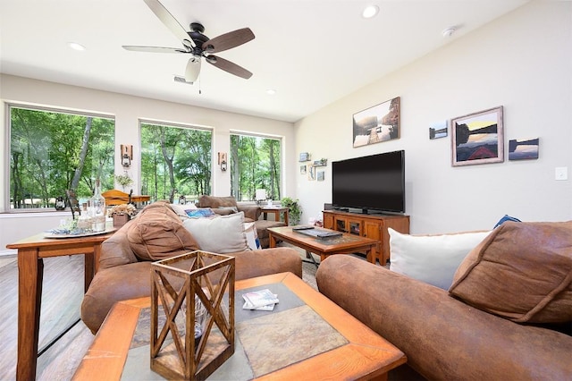 living area with ceiling fan, wood finished floors, and recessed lighting