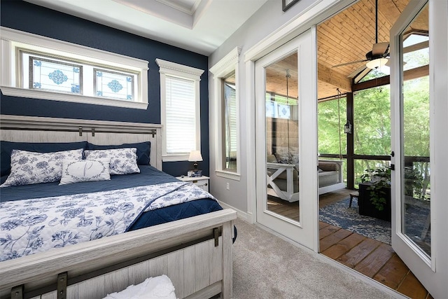 carpeted bedroom featuring access to outside and baseboards