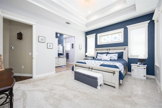 bedroom featuring carpet floors, a raised ceiling, crown molding, and baseboards