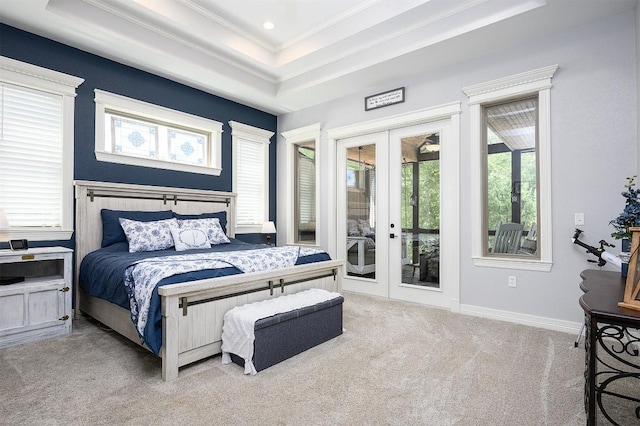 carpeted bedroom with baseboards, access to outside, ornamental molding, french doors, and a raised ceiling