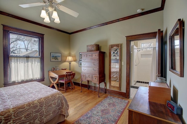 bedroom with ornamental molding, light wood-style floors, baseboards, and ceiling fan