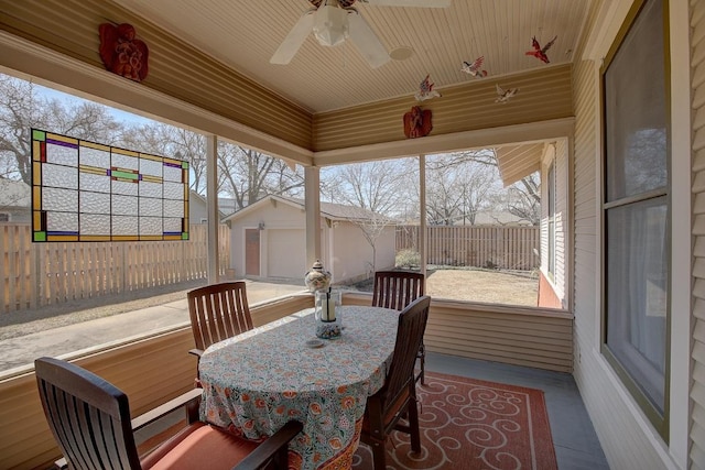 sunroom / solarium featuring wood ceiling and ceiling fan