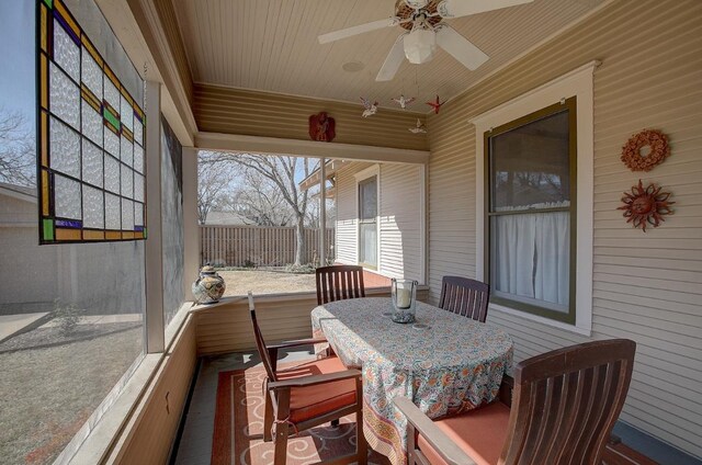 sunroom featuring ceiling fan