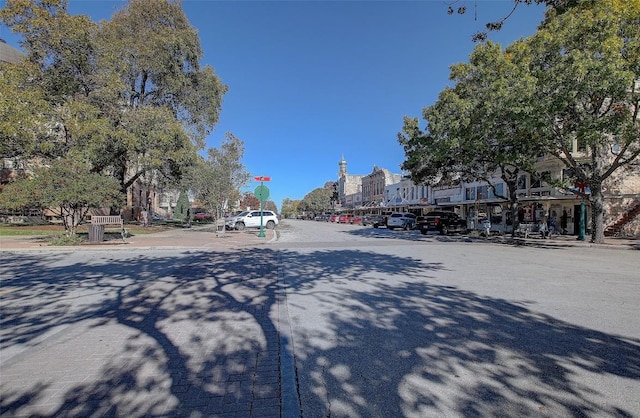 view of street with curbs and traffic signs