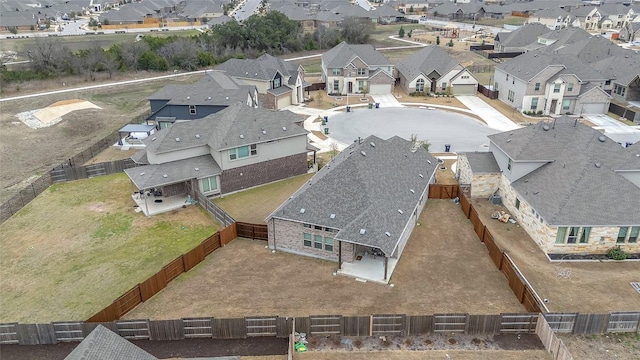 birds eye view of property with a residential view